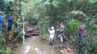 Scott Scheers, Gavin Amos and Evan Supple work with La Laguna community members to survey existing water sources.