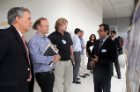 Faculty judges (from left) John A. Sellick, Jr., DO, Jeffrey M. Lackner, PsyD, and Richard J. Quigg, Jr., MD, learn the results of a study from endocrinology fellow Manav Batra, MD.