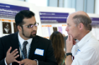Resident Usman Younus, MBBS (left), discusses findings with John K. Crane MD, PhD.