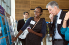 Ashley Jeanlus discusses her research project with Timothy Murphy, MD. 