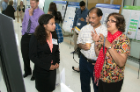 Maria Ritchie (left) shares the results of her study with Alexander Jacob and Jessy Alexander, PhD.