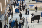 The atrium of the new downtown home of the Jacobs School of Medicine and Biomedical Sciences is filled with researchers displaying their posters during the Department of Medicine’s sixth annual Research Day.