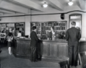 The charging desk of the University Library. The library was housed in Hayes Hall until 1977, when its contents were moved to the new Lockwood Memorial Library on North Campus. University Archives Photograph Collection (UA 20K)