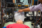 Researchers are using a variety of methods, including a bag of ice water, to determine different temperatures that elicit the human dive reflex. Photo: Douglas Levere.