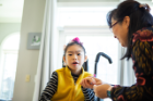 Yuna (left) at home with her mother, Soo-Kyung Lee. Credit: Douglas Levere / University at Buffalo