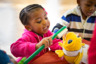 Demonstrating the proper brushing technique.