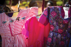 Colorful dresses sewn by young women.