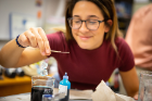 Nina Pace checks on her double crystal after adding coloring to her solution.