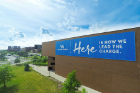 This banner on the outside of Alumni Arena was one of the first exterior branding signs that was installed at the launch of the brand. Photo: Douglas Levere