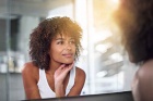 woman looking in the mirror. 