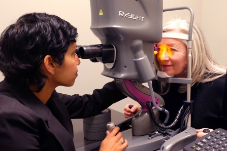 Dr. Sandra Sieminski performing a cataract lens exam with a female patient.